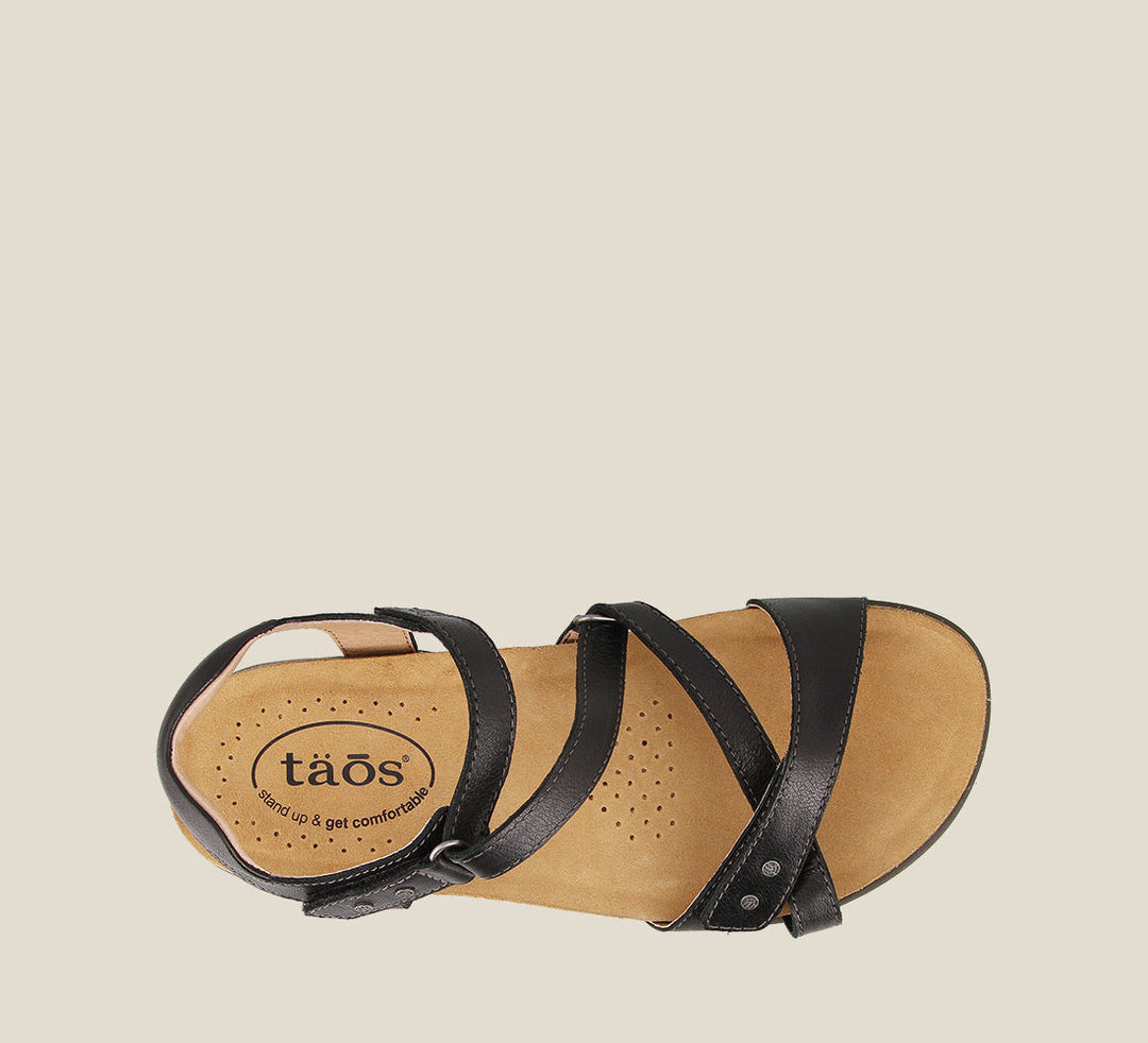 Top down angle of Grand Z Black Z strap sandal on our cork footbed featuring soft leather complete adjustability metal rivets and a rubber outsole. - size 6