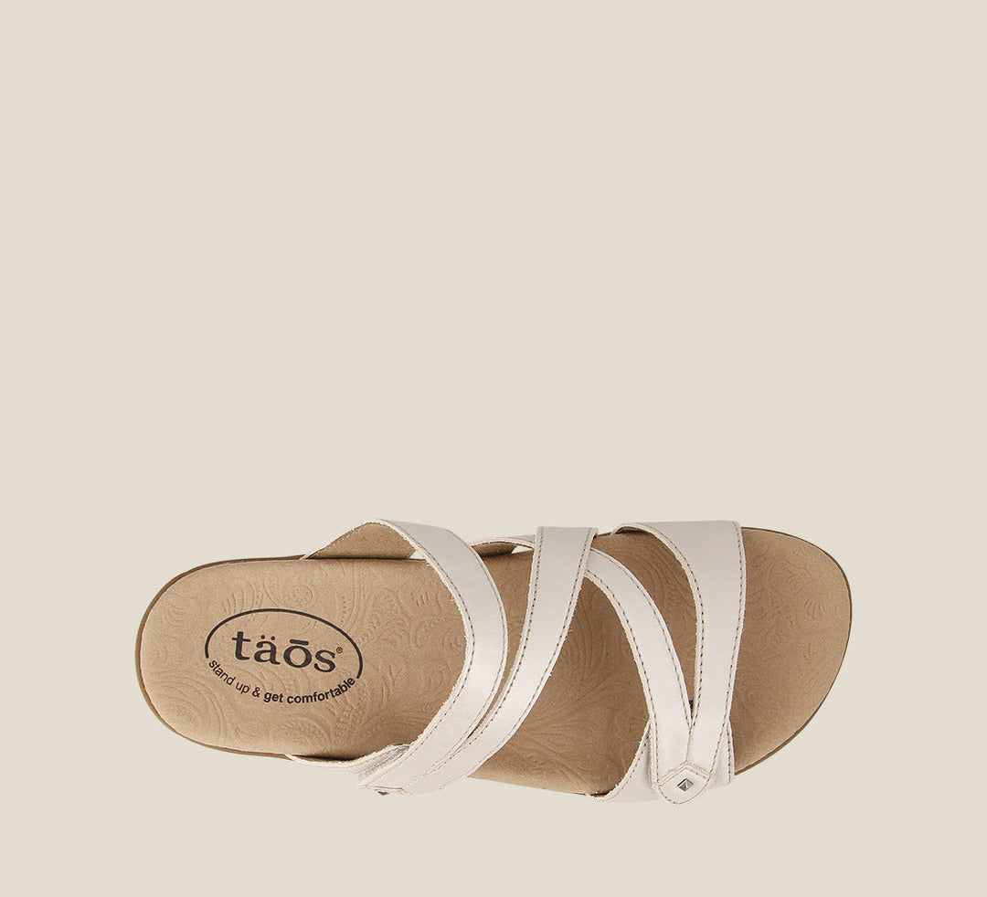 Top down angle of Double U White Pearl Casual leather slide sandal with metal rivets hook and loop straps and a rubber outsole. - size 6