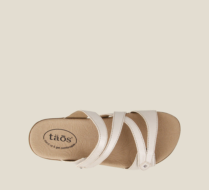 Top down angle of Double U White Pearl Casual leather slide sandal with metal rivets hook and loop straps and a rubber outsole. - size 6