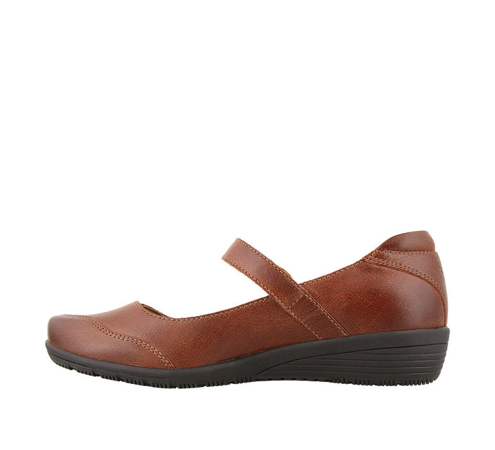 Instep angle of Cognac Leather mary jane featuring a hook and loop strap closure and rubber outsole - size 6