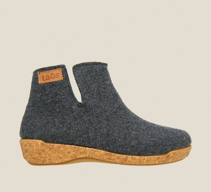 Outside angle of Woolly Boolly Charcoal Wool slip on bootie with cork detail a supportive footbed and rubber outsole. - size 36