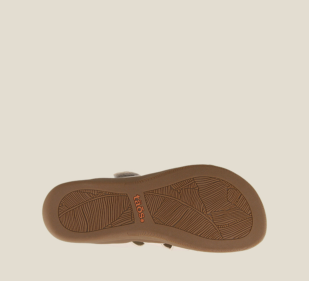 Outsole angle of Double U White Pearl Casual leather slide sandal with metal rivets hook and loop straps and a rubber outsole. - size 6