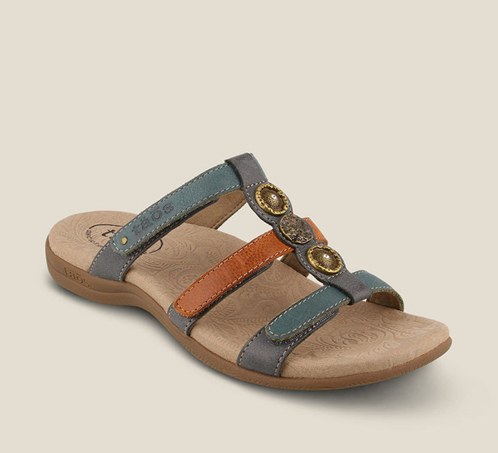 3/4 Angle of Prize 4 Teal Multi Casual leather slide sandal with pounded medallions jewel hardware hook and loop straps and a rubber outsole. - size 6