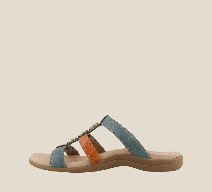 Inside angle of Prize 4 Teal Multi Casual leather slide sandal with pounded medallions jewel hardware hook and loop straps and a rubber outsole. - size 6