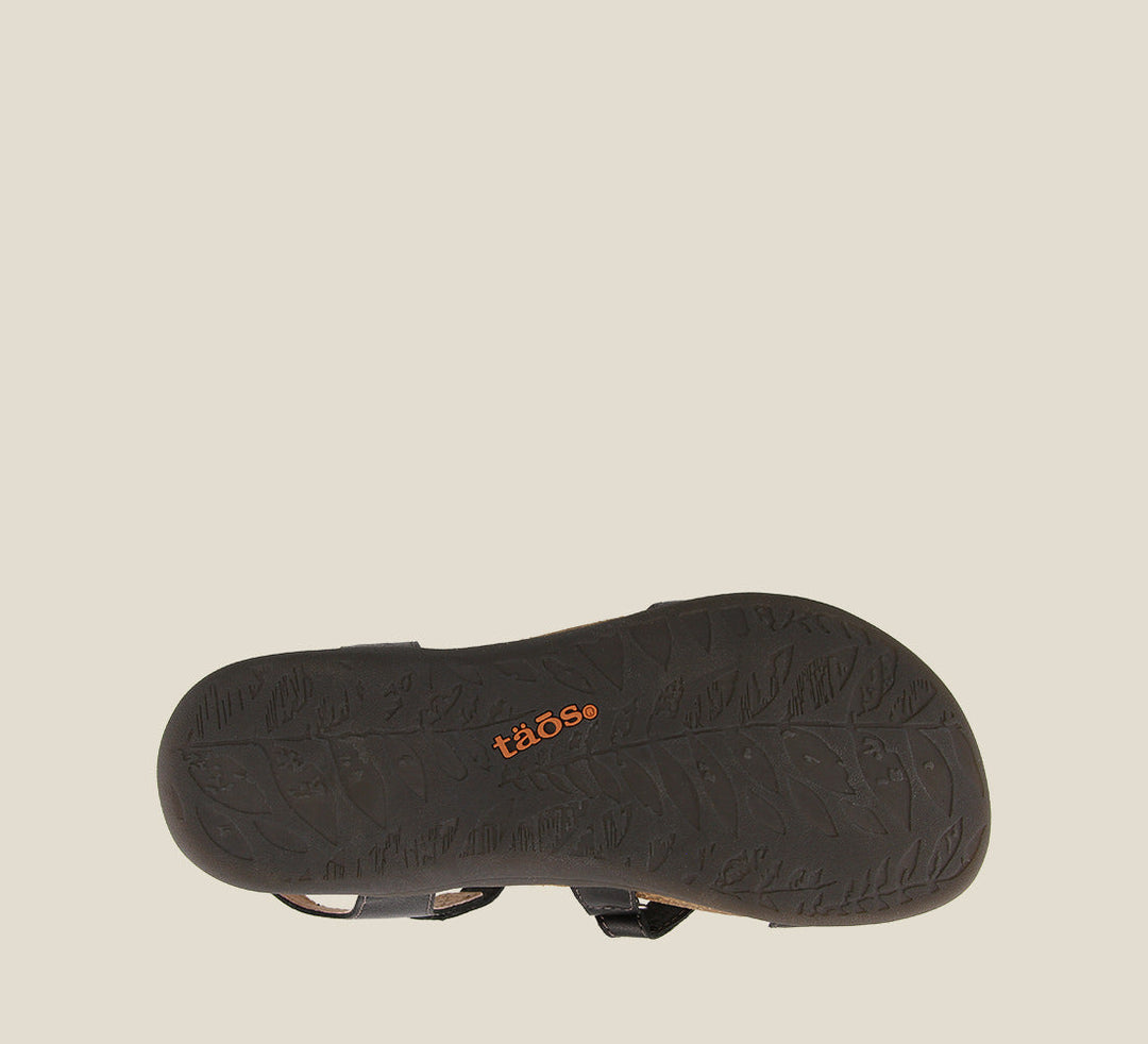 Outsole angle of Grand Z Black Z strap sandal on our cork footbed featuring soft leather complete adjustability metal rivets and a rubber outsole. - size 6