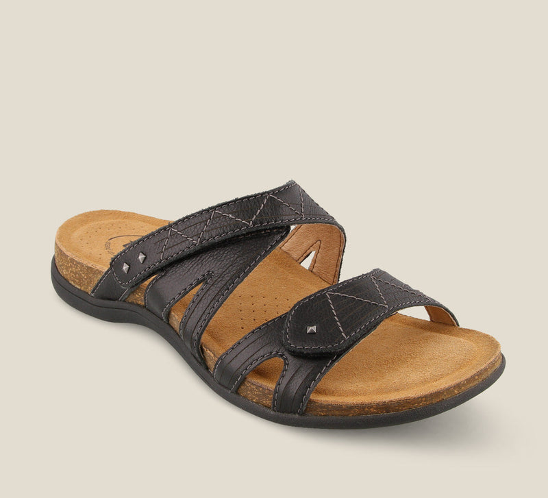 3/4 Angle of Premier Black Slide sandal featuring two adjustable hook and loop straps detailed stitching and metal studs. - size 6