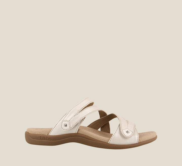 Outside angle of Double U White Pearl Casual leather slide sandal with metal rivets hook and loop straps and a rubber outsole. - size 6